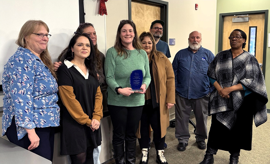 Former Goldman Awards winners congratulate Annie Mitchell on her award. From left: Nancy Howell, Sarah Civile, Dee Eckert,
Annie Mitchell, Brianna Malvai, Paul Thorstenson, Tom McCluskey and Hope Badroe.